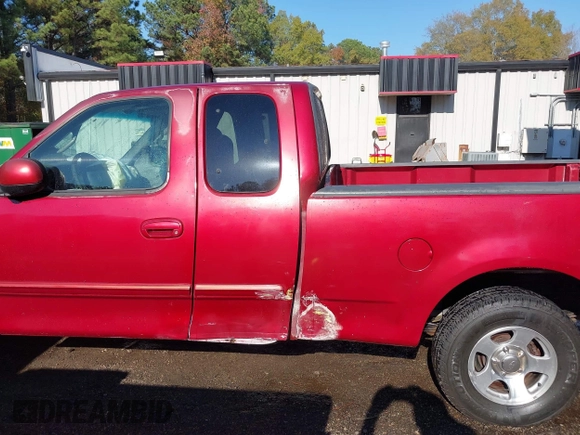 2000 Ford F-150 XL with VIN 1FTRX17L7YKA59717, listed as a IAAI auction lot 40887691 with 104,095 mi miles. Bid and sale history available at carsss.com. Image 14.