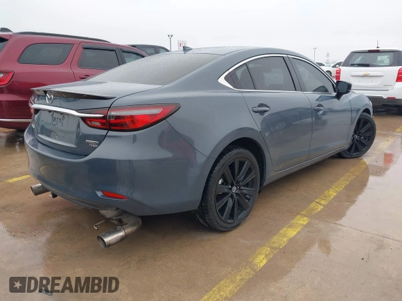 2021 Mazda 6 Carbon Edition with VIN JM1GL1WY0M1600414, listed as a IAAI auction lot 41551393 with 36,780 mi miles and . Bid and sale history available at DreamBid. Image 4.
