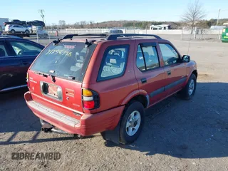 1999 Isuzu Rodeo S with VIN 4S2CM58W6X4336332, listed as a IAAI auction lot 41758338 with 183,983 mi miles. Bid and sale history available at carsss.com. Image 4.