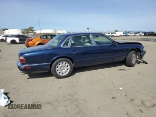 2000 Jaguar XJ with VIN SAJDA14C7YLF18873, listed as a Copart auction lot 50032495 with Not Provided miles and Salvage Title. Bid and sale history available at DreamBid. Image 3.