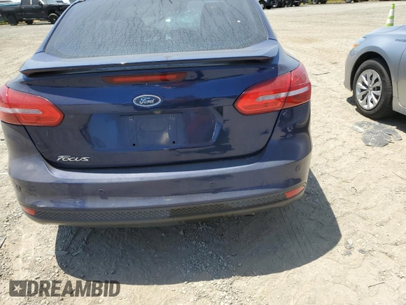 2016 Ford Focus Titanium z VIN 1FADP3J2XGL319399, wystawiony jako Copart lot #59258745 z przebiegiem 215 296 mil mil oraz Szkoda całkowita • Salvage title. Historia ofert i sprzedaży dostępna na DreamBid. Obrazek 6.