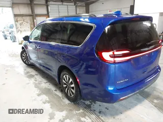 2021 Chrysler Pacifica Touring L z VIN 2C4RC1BGXMR503108, wystawiony jako IAAI lot #41914136 z przebiegiem 98 685 mil mil oraz . Historia ofert i sprzedaży dostępna na DreamBid. Obrazek 3.