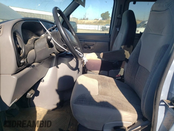 1999 Ford Econoline Passenger XL with VIN 1FBSS31L6XHB60672, listed as a Copart auction lot 79319714 with 295,551 mi miles and Clean Title. Bid and sale history available at DreamBid. Image 7.