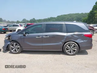 2022 Honda Odyssey Touring z VIN 5FNRL6H83NB023583, wystawiony jako IAAI lot #42425498 z przebiegiem Nie podano mil oraz . Historia ofert i sprzedaży dostępna na DreamBid. Obrazek 13.