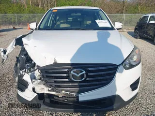 2016 Mazda CX-5 Sport with VIN JM3KE2BY2G0819604, listed as a IAAI auction lot 42059846 with 124,911 mi miles. Bid and sale history available at carsss.com. Image 17.