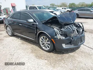 2013 Cadillac XTS Premium z VIN 2G61S5S38D9100879, wystawiony jako IAAI lot #42050059 z przebiegiem 126 368 mil mil oraz . Historia ofert i sprzedaży dostępna na DreamBid. Obrazek 1.