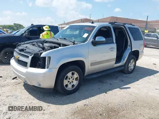 2013 Chevrolet Tahoe LS with VIN 1GNSCAE08DR153829, listed as a IAAI auction lot 42742266 with 216,821 mi miles and . Bid and sale history available at DreamBid. Image 2.