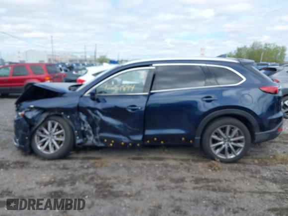 2021 Mazda CX-9 Grand Touring with VIN JM3TCBDY3M0537975, listed as a IAAI auction lot 42251894 with 50,156 mi miles and . Bid and sale history available at DreamBid. Image 14.