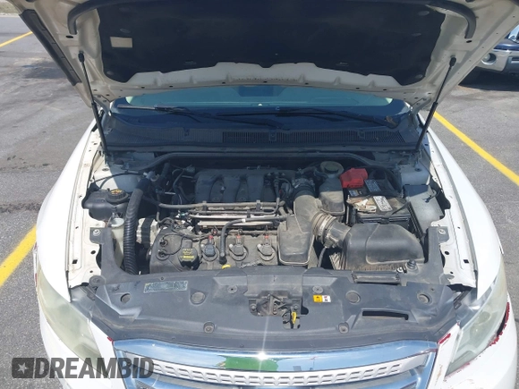 2014 Ford Taurus SEL with VIN 1FAHP2E86EG132676, listed as a IAAI auction lot 41943392 with 183,633 mi miles. Bid and sale history available at carsss.com. Image 10.