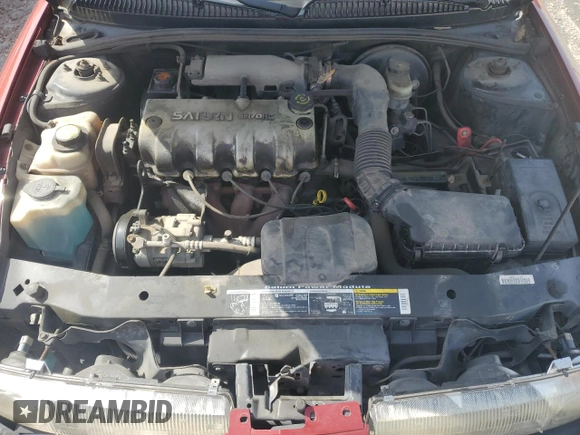 1999 Saturn SL z VIN 1G8ZH5288XZ273509, wystawiony jako Copart lot #55508215 z przebiegiem 168 946 mil mil oraz Szkoda całkowita • Salvage title. Historia ofert i sprzedaży dostępna na DreamBid. Obrazek 11.