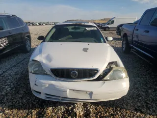 2000 Mercury Sable z VIN 1MEFM53U7YG640279, wystawiony jako Copart lot #70701264 z przebiegiem 118 790 mil mil oraz Szkoda całkowita • Salvage title. Historia ofert i sprzedaży dostępna na DreamBid. Obrazek 5.