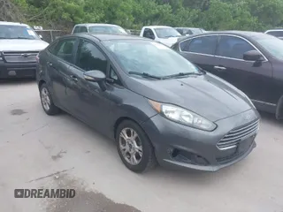 2015 Ford Fiesta SE with VIN 3FADP4BJ5FM101119, listed as a IAAI auction lot 42072760 with 173,894 mi miles. Bid and sale history available at carsss.com. Image 1.