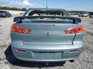 2009 Mitsubishi Lancer ES with VIN JA3AU26U89U019138, listed as a Copart auction lot 74227264 with 223,351 mi miles and Salvage Title. Bid and sale history available at DreamBid. Image 6.