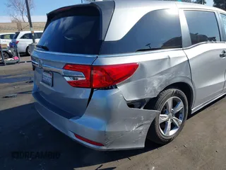 2018 Honda Odyssey EX-L with VIN 5FNRL6H71JB089289, listed as a IAAI auction lot 41813322 with 94,933 mi miles and . Bid and sale history available at DreamBid. Image 12.