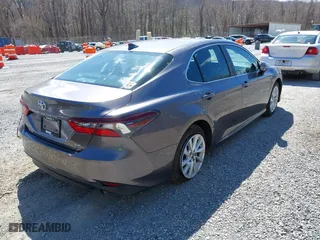 2022 Toyota Camry LE with VIN 4T1C11AK2NU054251, listed as a IAAI auction lot 41880293 with 48,559 mi miles. Bid and sale history available at carsss.com. Image 4.