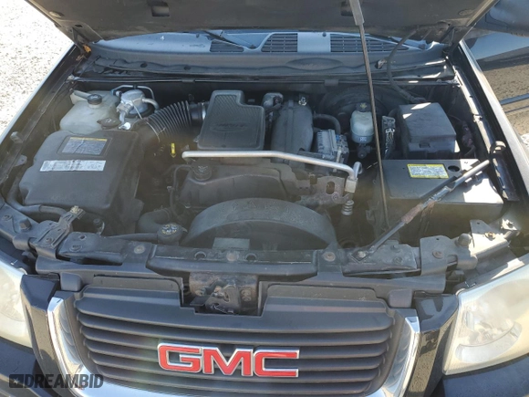 2005 GMC Envoy XL SLT with VIN 1GKET16S256109757, listed as a Copart auction lot 77220144 with 246,444 mi miles and Salvage Title. Bid and sale history available at carsss.com. Image 12.