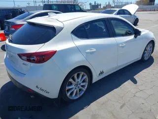 2015 Mazda 3 S Grand Touring with VIN JM1BM1M39F1233093, listed as a IAAI auction lot 42245609 with 137,487 mi miles and . Bid and sale history available at DreamBid. Image 4.