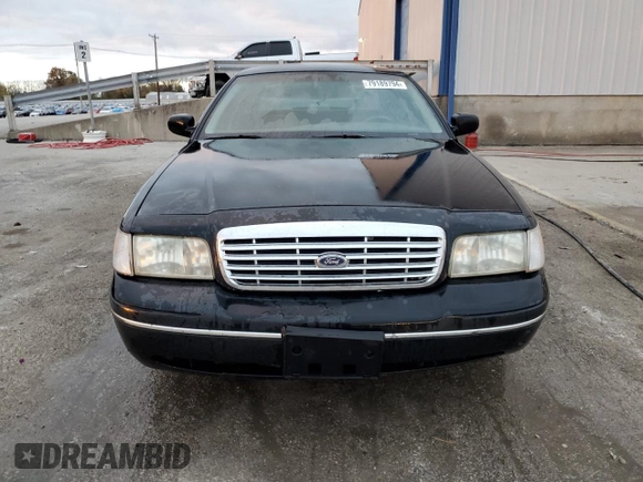 2000 Ford Crown Victoria LX z VIN 2FAFP74W3YX122481, wystawiony jako Copart lot #79189794 z przebiegiem 277 772 mil mil oraz Nie do naprawy • Non repairable. Historia ofert i sprzedaży dostępna na DreamBid. Obrazek 5.