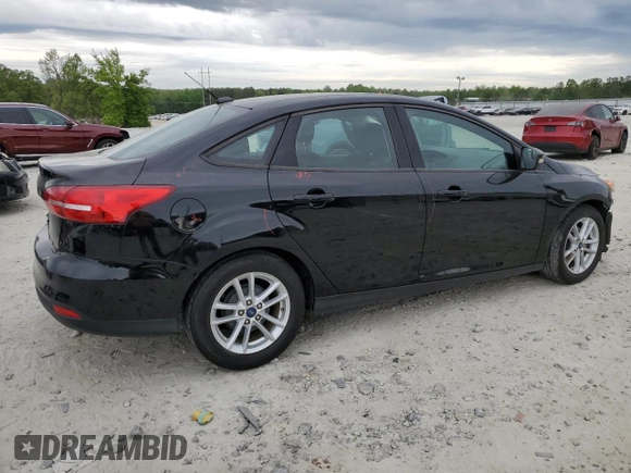 2017 Ford Focus SE with VIN 1FADP3F22HL291799, listed as a Copart auction lot 53789195 with 81,646 mi miles and Salvage title. Bid and sale history available at DreamBid. Image 3.