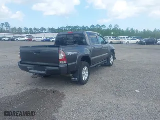 2014 Toyota Tacoma with VIN 5TFLU4EN9EX099414, listed as a IAAI auction lot 40528514 with 122,827 mi miles. Bid and sale history available at carsss.com. Image 4.