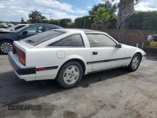 1985 Nissan 300ZX z VIN JN1HZ16S9FX050874, wystawiony jako Copart lot #72283704 z przebiegiem 139 895 mil mil oraz Tytuł czysty. Historia ofert i sprzedaży dostępna na DreamBid. Obrazek 3.