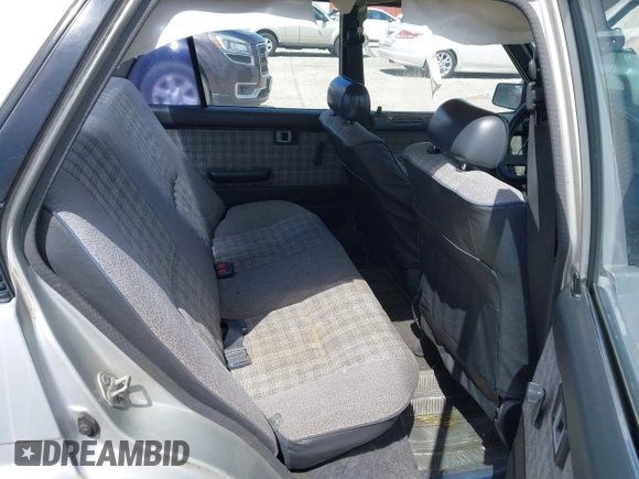 1986 Toyota Corolla with VIN JT2AE82E7G3318230, listed as a IAAI auction lot 42042219 with 74,689 mi miles and . Bid and sale history available at DreamBid. Image 8.