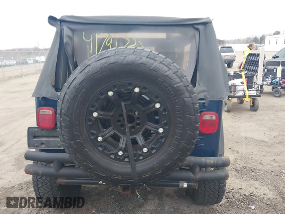 2003 Jeep Wrangler X with VIN 1J4FA39S23P300447, listed as a IAAI auction lot 41791733 with 165,576 mi miles. Bid and sale history available at carsss.com. Image 16.