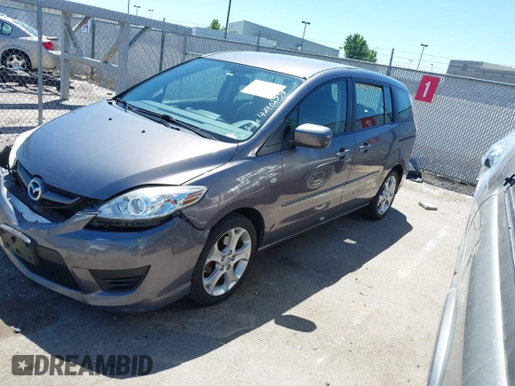2009 Mazda 5 Touring z VIN JM1CR29L490340616, wystawiony jako IAAI lot #42402779 z przebiegiem 104 180 mil mil oraz . Historia ofert i sprzedaży dostępna na DreamBid. Obrazek 2.