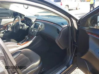 2012 Buick LaCrosse Premium 1 z VIN 1G4GD5E35CF282278, wystawiony jako IAAI lot #42146380 z przebiegiem 92 968 mil mil oraz . Historia ofert i sprzedaży dostępna na DreamBid. Obrazek 5.