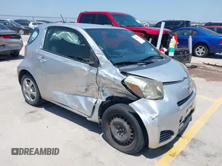 2012 Scion iQ z VIN JTNJJXB07CJ018562, wystawiony jako IAAI lot #42404672 z przebiegiem 79 867 mil mil oraz . Historia ofert i sprzedaży dostępna na DreamBid. Obrazek 1.