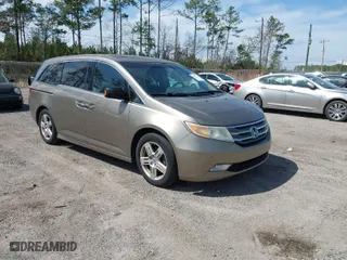 2011 Honda Odyssey Touring with VIN 5FNRL5H93BB077934, listed as a IAAI auction lot 41807514 with 215,685 mi miles. Bid and sale history available at carsss.com. Image 1.
