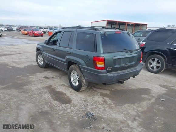 2003 Jeep Grand Cherokee Laredo with VIN 1J4GW48S93C583644, listed as a IAAI auction lot 41656314 with 256,653 mi miles. Bid and sale history available at carsss.com. Image 3.