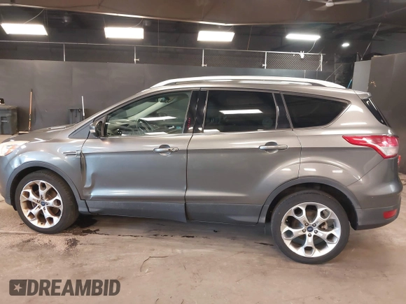 2014 Ford Escape Titanium with VIN 1FMCU9JX0EUE45254, listed as a IAAI auction lot 42038700 with 60,103 mi miles. Bid and sale history available at carsss.com. Image 14.