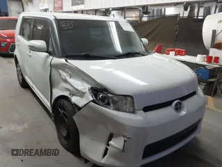 2014 Scion xB with VIN JTLZE4FE1EJ060281, listed as a IAAI auction lot 41477386 with 61,423 mi miles. Bid and sale history available at carsss.com. Image 1.