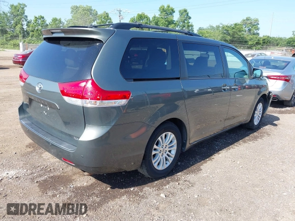 2014 Toyota Sienna XLE with VIN 5TDYK3DC6ES414892, listed as a IAAI auction lot 42545666 with 135,805 mi miles and . Bid and sale history available at DreamBid. Image 4.
