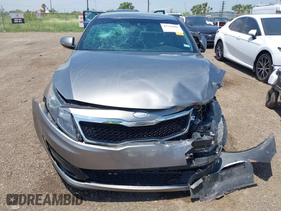 2013 Kia Optima EX z VIN 5XXGN4A7XDG258162, wystawiony jako IAAI lot #42228606 z przebiegiem 129 296 mil mil oraz . Historia ofert i sprzedaży dostępna na DreamBid. Obrazek 12.