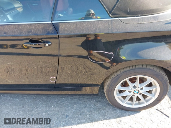 2011 BMW 1 Series 128i with VIN WBAUL7C55BVM81049, listed as a IAAI auction lot 41892811 with 50,659 mi miles and . Bid and sale history available at carsss.com. Image 6.