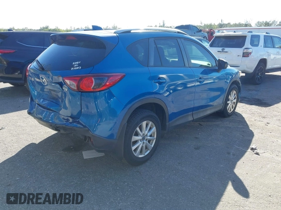 2014 Mazda CX-5 Touring with VIN JM3KE2CYXE0310873, listed as a IAAI auction lot 41309633 with 175,325 mi miles and . Bid and sale history available at DreamBid. Image 4.