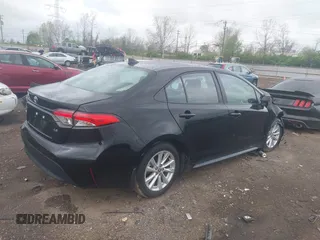2023 Toyota Corolla LE with VIN 5YFB4MDE1PP058774, listed as a IAAI auction lot 42068978 with 19,802 mi miles and . Bid and sale history available at DreamBid. Image 4.