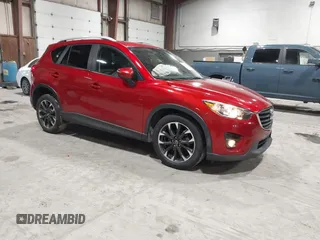 2016 Mazda CX-5 Grand Touring with VIN JM3KE4DY5G0709574, listed as a IAAI auction lot 41532260 with 105,145 mi miles and . Bid and sale history available at DreamBid. Image 1.