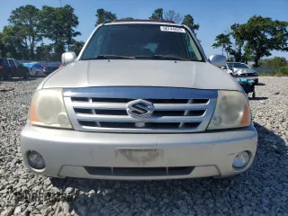 2004 Suzuki XL7 LX z VIN JS3TY92V144105911, wystawiony jako Copart lot #56744425 z przebiegiem 253 975 mil mil oraz Szkoda całkowita • Salvage title. Historia ofert i sprzedaży dostępna na DreamBid. Obrazek 5.