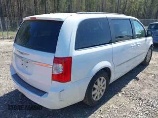 2014 Chrysler Town & Country Touring with VIN 2C4RC1BG9ER148966, listed as a IAAI auction lot 41886625 with 104,299 mi miles. Bid and sale history available at carsss.com. Image 4.