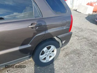 2009 Kia Sportage LX with VIN KNDJE723097623239, listed as a IAAI auction lot 41233933 with 169,444 mi miles. Bid and sale history available at carsss.com. Image 6.