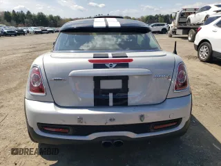 2012 MINI Coupe S z VIN WMWSX3C59CT465700, wystawiony jako Copart lot #52966245 z przebiegiem 136 253 mil mil oraz Szkody całkowita. Historia ofert i sprzedaży dostępna na DreamBid. Obrazek 6.