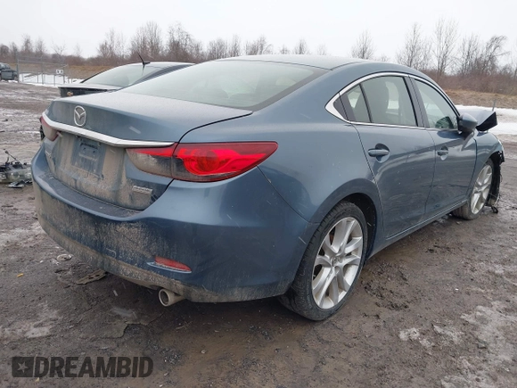 2014 Mazda 6 i Touring with VIN JM1GJ1T53E1112768, listed as a IAAI auction lot 41727440 with 166,081 mi miles and . Bid and sale history available at DreamBid. Image 4.