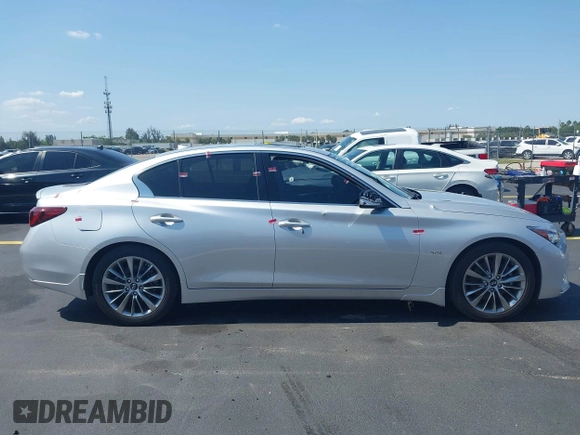 2019 Infiniti Q50 Luxe z VIN JN1EV7AP3KM510305, wystawiony jako IAAI lot #42225255 z przebiegiem 33 902 mil mil oraz . Historia ofert i sprzedaży dostępna na DreamBid. Obrazek 14.