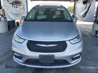 2021 Chrysler Pacifica Hybrid Touring L with VIN 2C4RC1L7XMR593911, listed as a Copart auction lot 57842415 with 74,910 mi miles and Salvage title. Bid and sale history available at DreamBid. Image 5.