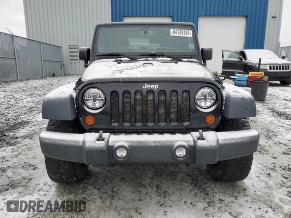 2013 Jeep Wrangler Rubicon 10th Anniversary with VIN 1C4BJWCG6DL507667, listed as a Copart auction lot 84139134 with 264,970 mi miles and Salvage Title. Bid and sale history available at DreamBid. Image 5.