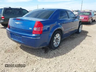 2009 Chrysler 300 Touring with VIN 2C3LA53V89H512049, listed as a IAAI auction lot 41883948 with 167,923 mi miles. Bid and sale history available at carsss.com. Image 4.