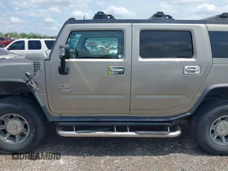 2003 Hummer H2 with VIN 5GRGN23U23H148326, listed as a IAAI auction lot 42068326 with 149,396 mi miles. Bid and sale history available at carsss.com. Image 14.
